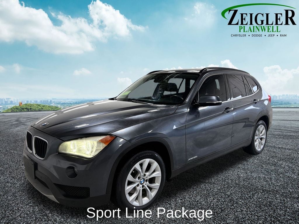 Used 2014 BMW X1 28i with VIN WBAVL1C56EVR93943 for sale in Plainwell, MI